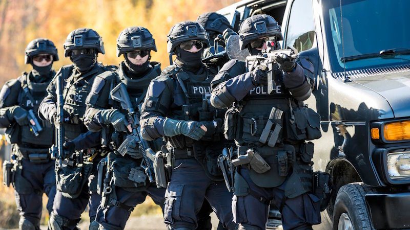 Counter terrorism police with automatic weapons using the courts as a weapon